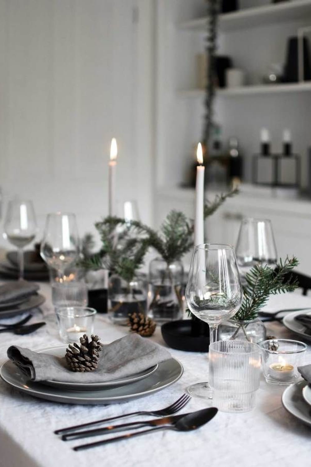 Minimalist Christmas table styling with fir, candles & pine cones | These  Four Walls